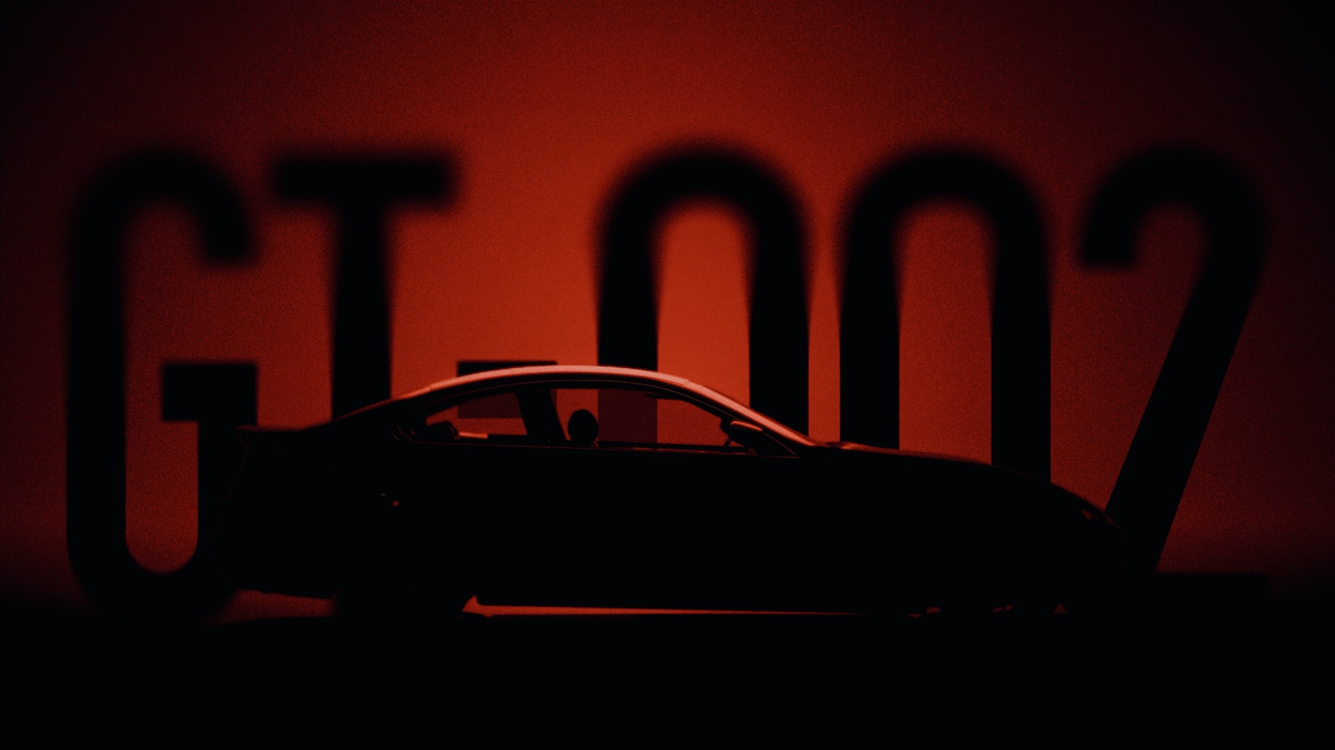 GT-002 concept car in silhouette against a red wall bearing the GT-002 wordmark