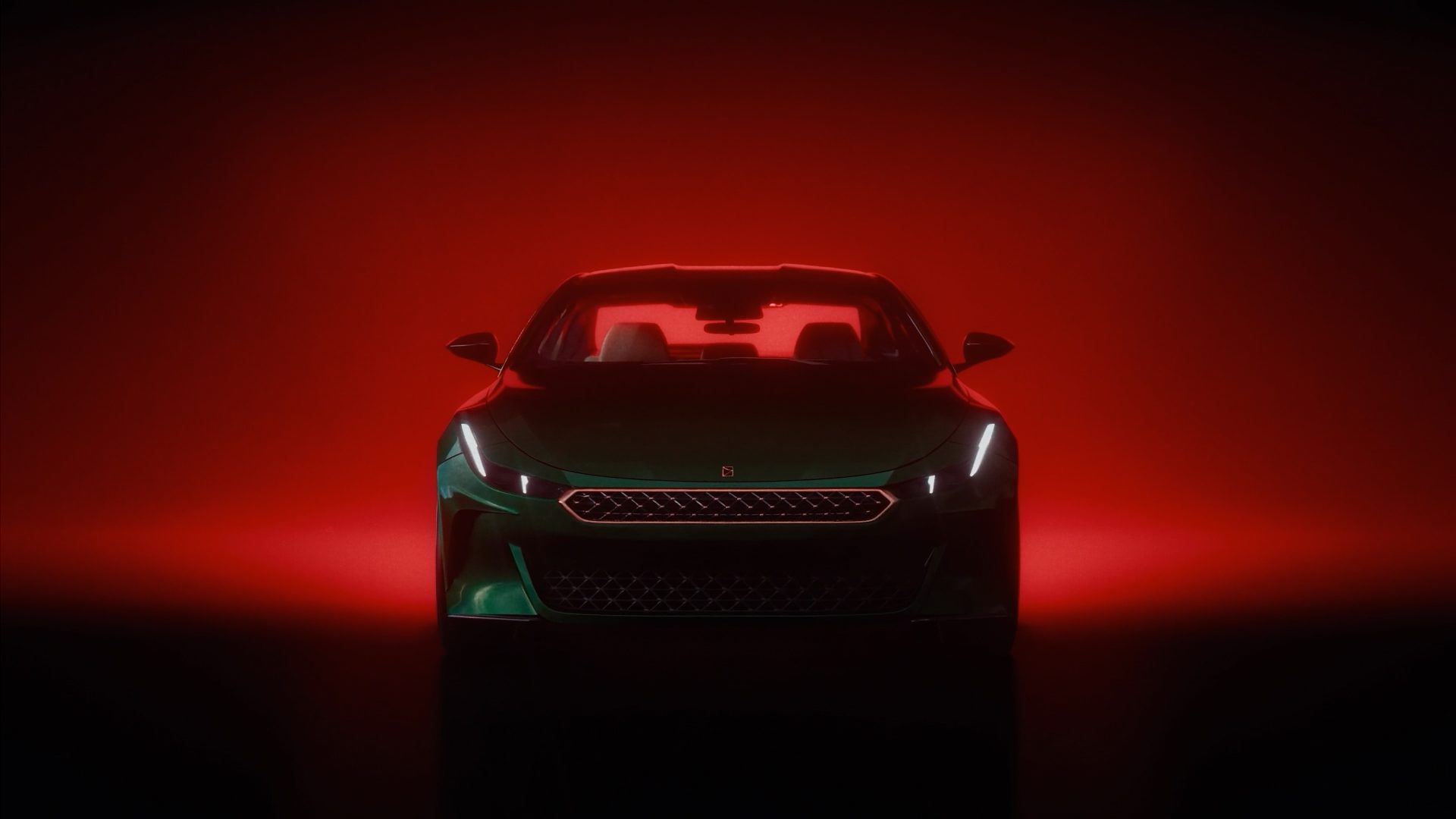 GT-002 concept car at three quarter view, green paint against a red background